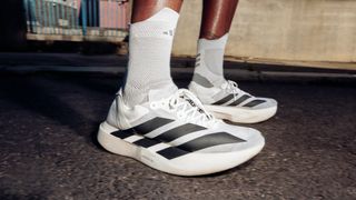 Close-up of Adidas Adizero Adios Pro Evo 1 running shoes on feet of unidentified runner